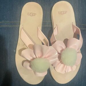 Ugg flip flops.  Pink flower.